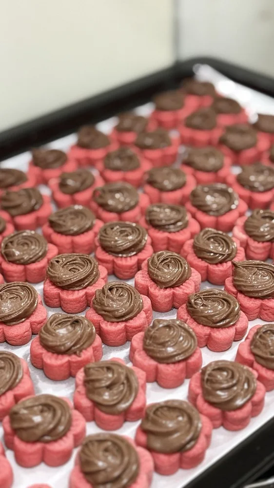 A tray of Mini Red Velvet Tarts with a Nutella swirl
